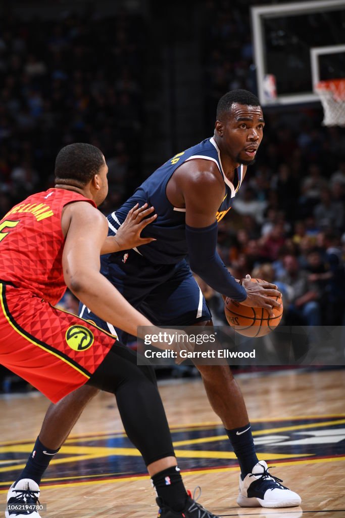 Paul Millsap of the Denver Nuggets handles the ball during a game... News Photo Getty Images Paul Millsap of the Denver Nuggets handles the ball during a game... News Photo Getty Images