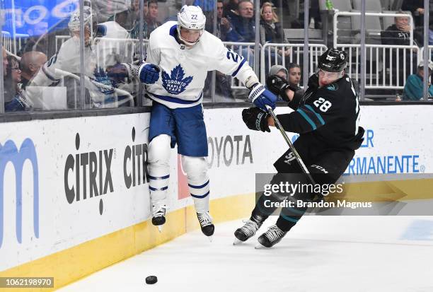 Timo Meier of the San Jose Sharks chases the puck with Nikita Zaitsev of the Toronto Maple Leafs at SAP Center on November 15, 2018 in San Jose,...