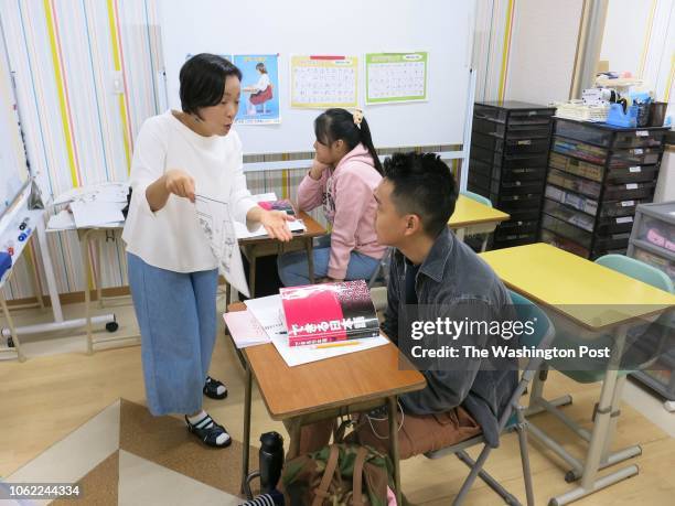 Teacher holds a Japanese language class for children of foreign workers at the YSC Global School in the city of Fussa in western Tokyo, Japan on Oct....