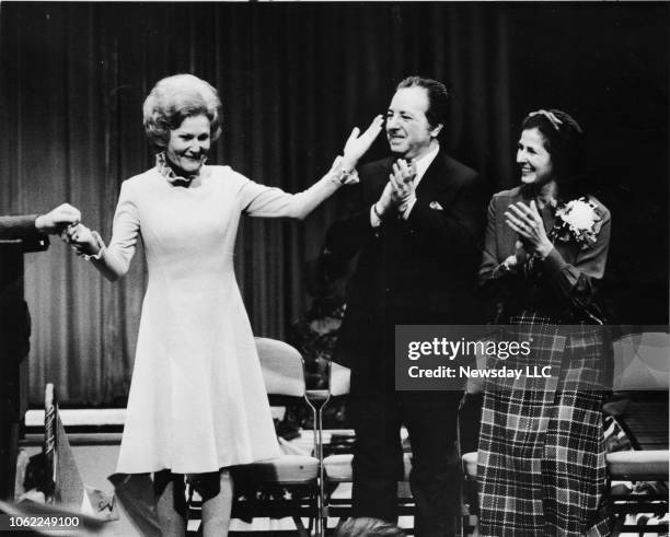 United States First Lady Pat Nixon, wife of President Richard M. Nixon is applauded by Nassau County Executive Ralph Caso and his wife, as she is...