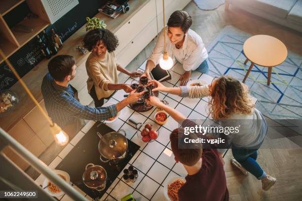 friends living and cooking together - kitchen elevation stock pictures, royalty-free photos & images
