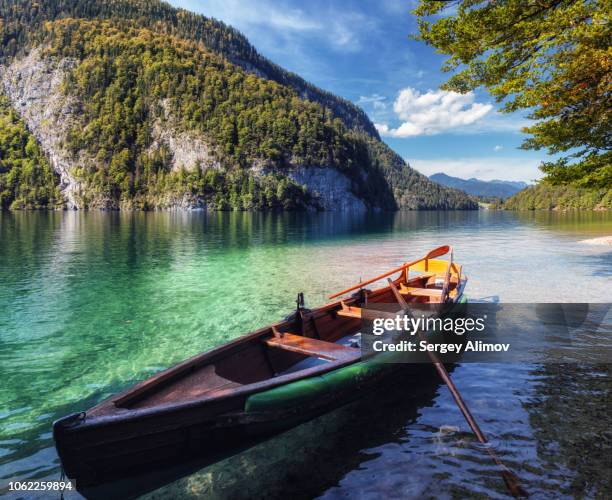 moored boat at königssee lake, germany - berchtesgaden stock-fotos und bilder