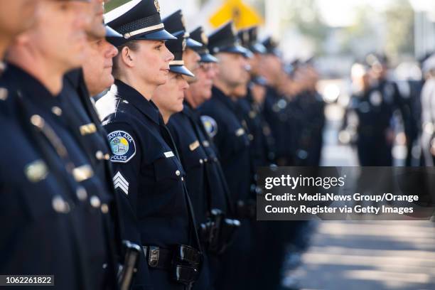 Officers wait to be inspected by Santa Ana Chief of Police David Valentin and his deputy chiefs during an inspection at their headquarters in Santa...