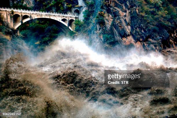 This photo taken on November 15, 2018 shows floodwaters flowing in Tiger Leaping Gorge or Hutiaoxia Gorge in Lijiang in China's southwestern Yunnan...