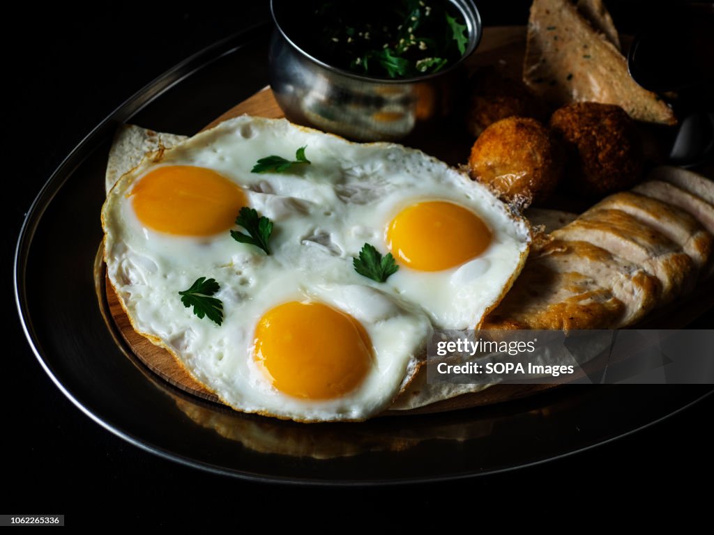 Fried eggs with mashed potatoes, in breadcrumbs and deep...