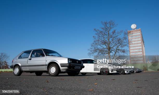 November 2018, Lower Saxony, Wolfsburg: An old VW Golf stands near the administration tower of the Volkswagen plant. Volkswagen's Supervisory Board...