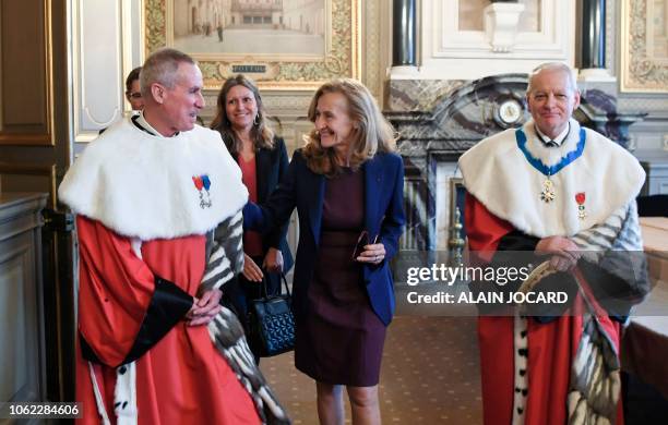 French Justice minister Nicole Belloubet poses for a photograph flanked by the newly appointed general prosecutor at the French Cassation court...