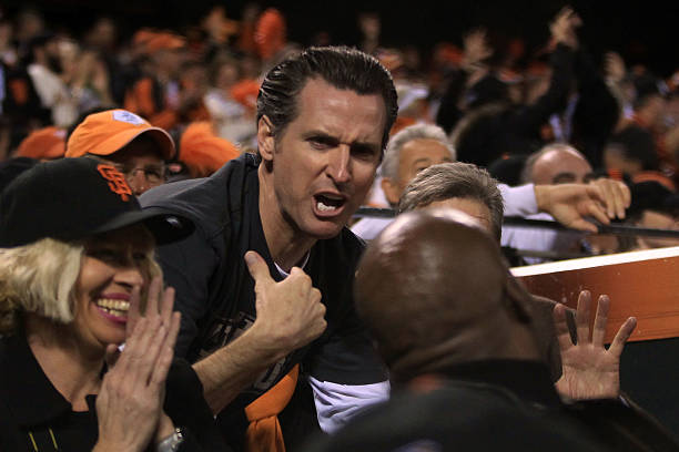 San Francisco Mayor Gavin Newsom talks with Barry Bonds during Game One of the 2010 MLB World Series at AT&T Park on October 27, 2010 in San...