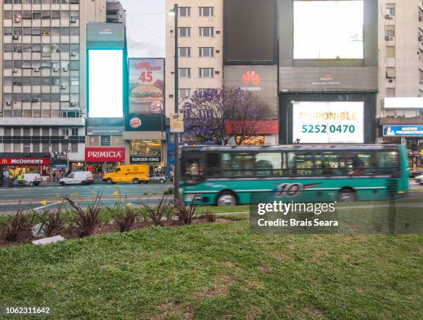 bus on the road. - billboard bus stockfoto's en -beelden