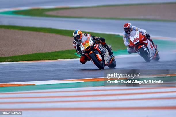 Isaac Vinales of Spain and Forward Racing Team rides followed by Tetsuta Nagashima of Japan and Idemitsu Honda Team Asia during the MotoGP of...