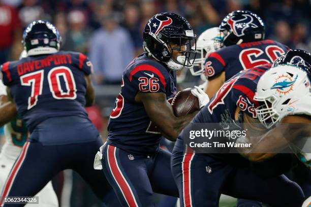 Lamar Miller of the Houston Texans runs the ball in the first half against the Miami Dolphins at NRG Stadium on October 25, 2018 in Houston, Texas.