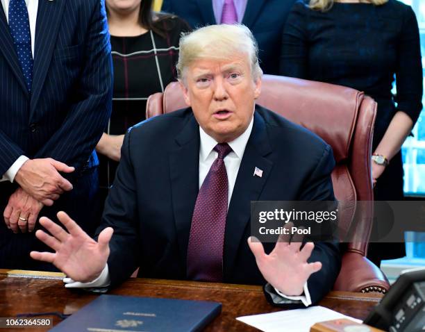 President Donald Trump speaks during a signing of the Cybersecurity and Infrastructure Security Agency Act in the Oval Office of the White House on...