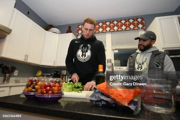 Donte DiVincenzo of the Milwaukee Bucks interacts with veterans while preparing dinner and playing board games on November 11, 2018 at the Zablocki...