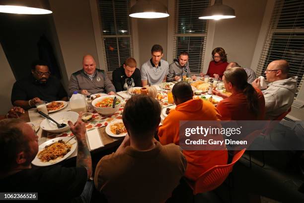 Brook Lopez and Donte DiVincenzo of the Milwaukee Bucks interact with veterans while preparing dinner and playing board games on November 11, 2018 at...