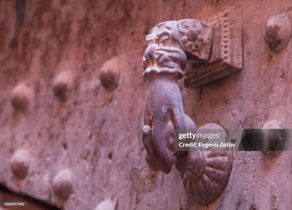 Close-up of old metallic door knocker shaped as "Hand of Fatima". Marrakesh, Morocco