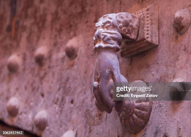 close-up of old metallic door knocker shaped as "hand of fatima". marrakesh, morocco - hand of fatima stock pictures, royalty-free photos & images