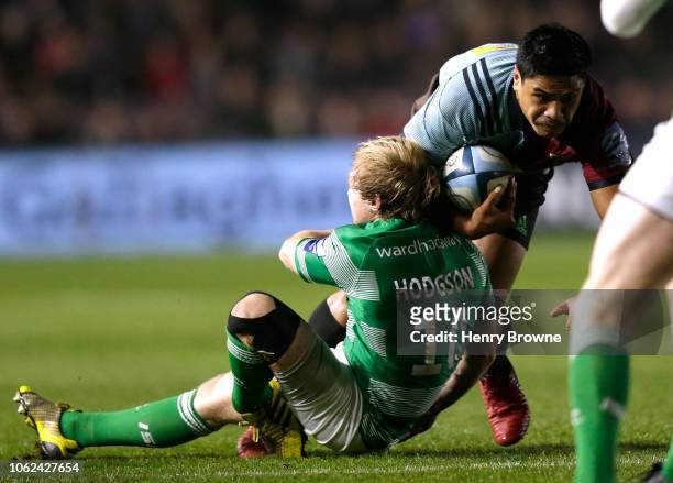 Joel Hodgson of Newcastle Falcons suffers a leg injury while tackling Ben Tapuai of Harlequins during the Gallagher Premiership Rugby match between...