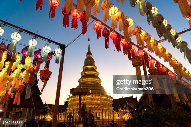 lamphun ,thailand november 01 ,2018 : buddist come around lantern festival  wat phra that hariphunchai  lamphun thailand - night and day festival stock pictures, royalty-free photos & images