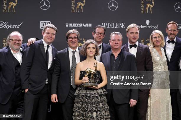 Cast and crew of 'TV Series of the Year' award winner Babylon Berlin pose with award during the 70th Bambi Awards winners board at Stage Theater on...