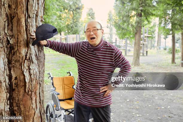 man watching far away with wheelchair - old man yelling stock pictures, royalty-free photos & images