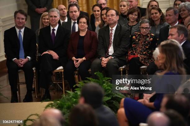 Supreme Court Justices, Brett Kavanaugh, Neil Gorsuch, Elena Kagan, Samuel Alito, Ruth Bader Ginsburg, and Chief Justice John Roberts attend a...