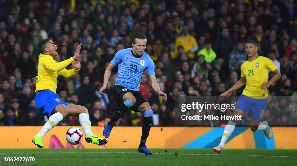 Danilo Luiz da Silva of Brazil is fouled by Diego Laxalt of Uruguay to conceed a penalty during the International Friendly between Brazil and Uruguay...