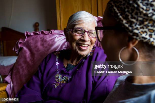 A woman bonding with her granddaughter.