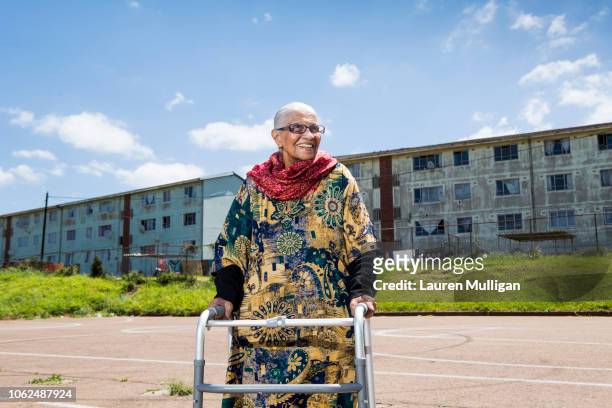 A Humanitarian and social activist, poses for a portrait near home in Austerville, Durban.