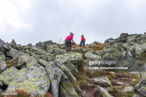 girls climbing on retezat peak, wonderful alpine mountain, retezat mountains, transylvania, romania, europe - alps romania stock pictures, royalty-free photos & images