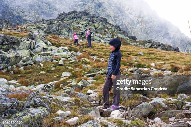 mother and daughters hiking in the mountains, wonderful alpine mountain, retezat mountains, transylvania, romania, europe - alps romania stock pictures, royalty-free photos & images