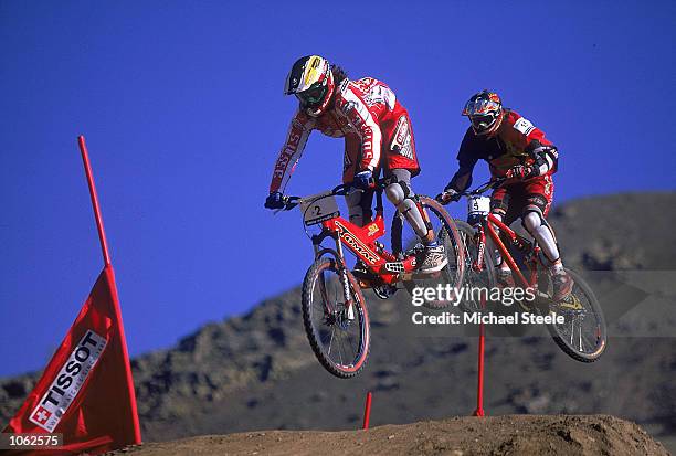 Sari Jorgensen of Switzerland and Helen Mortimer of Great Britain in action in the Dual Women's event during the World Mountain Bike Championships...