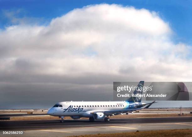 An Alaska Airlines Embraer passenger plane taxis at San Francisco International Airport in San Francisco, California.