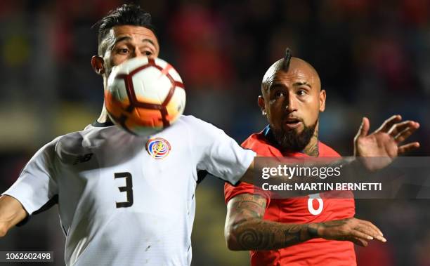 Chile's player Arturo Vidal , vies for the ball with Costa Rica's player Bryan Ruiz, during their friendly football match, at El Teniente stadium, in...