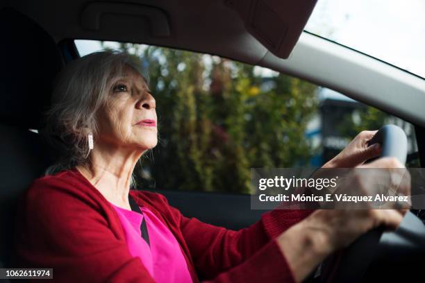 mature woman driving - altes auto stock-fotos und bilder