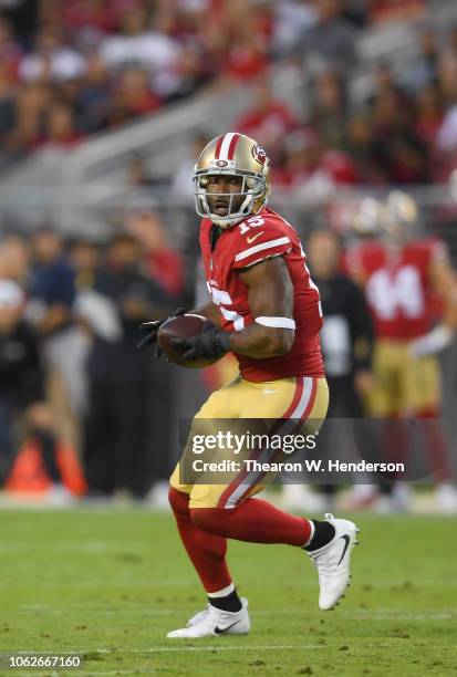Pierre Garcon of the San Francisco 49ers runs with the ball after catching a pass against the Oakland Raiders during the first half of their NFL...