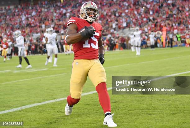 Pierre Garcon of the San Francisco 49ers scores a touchdown against the Oakland Raiders during the first half of their NFL football game at Levi's...