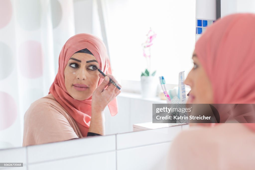 Woman putting on make-up