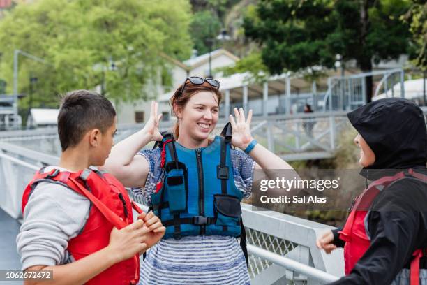 putting on safety vest - kayaking australia stock pictures, royalty-free photos & images