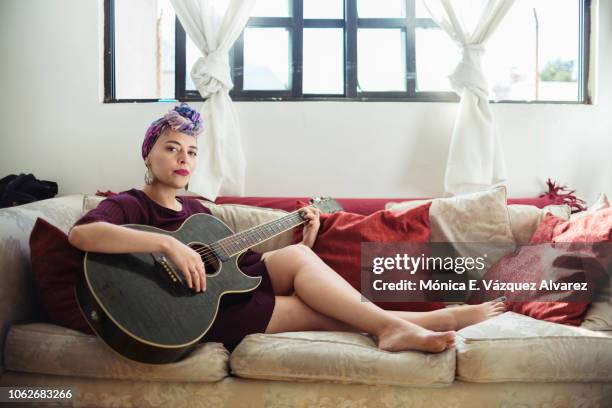 young woman playing the guitar - beautiful mexican women stock pictures, royalty-free photos & images