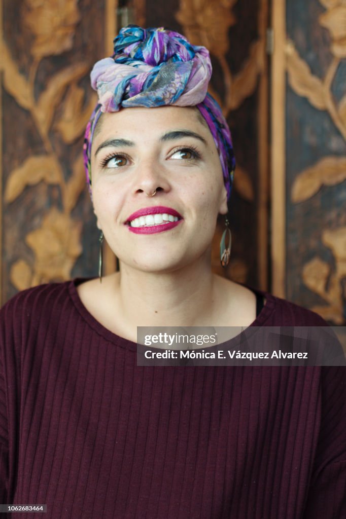 Young woman wearing a head scarf