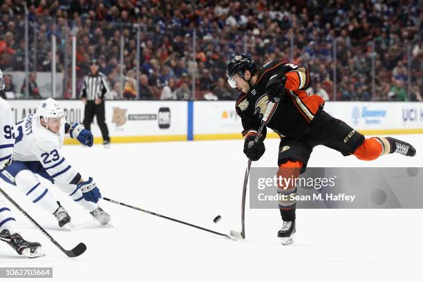 Pontus Aberg of the Anaheim Ducks shoots the puck as Travis Dermott of the Toronto Maple Leafs defends during the third period of a game at Honda...