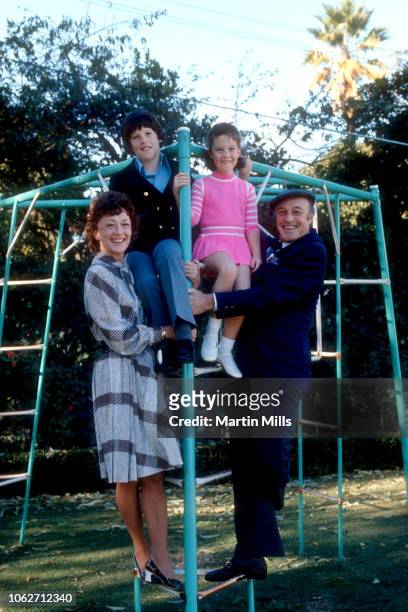 Actor Gene Kelly with his wife Jeanne Coyne , son Timothy and daughter Bridget, pose for a family portrait circa 1971 in Los Angeles, California.
