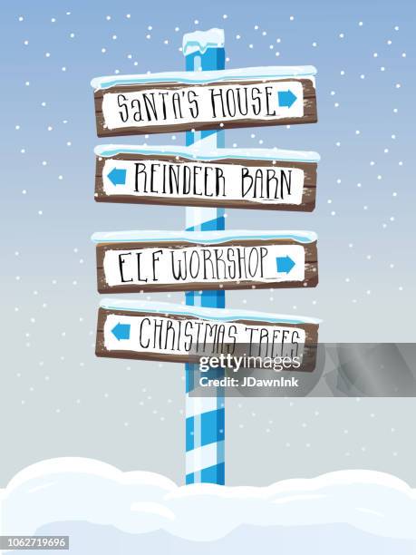 christmas themed wooden winter sign with hand lettered text - elf workshop stock illustrations