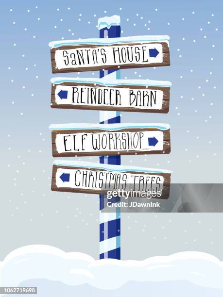 christmas themed wooden winter sign with hand lettered text - elf workshop stock illustrations