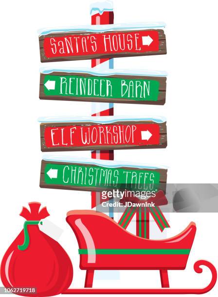 christmas themed wooden winter sign with hand lettered text - elf workshop stock illustrations