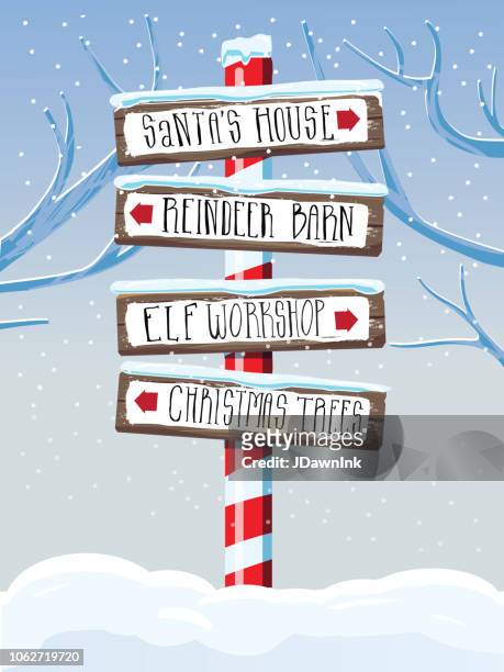 christmas themed wooden winter sign with hand lettered text - elf workshop stock illustrations