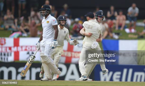 England keeper Ben Foakes and Ben Stokes congratulate Keaton Jennings who had deflected a shot by Sri Lanka batsman Dimuth Karunaratne to be caught...