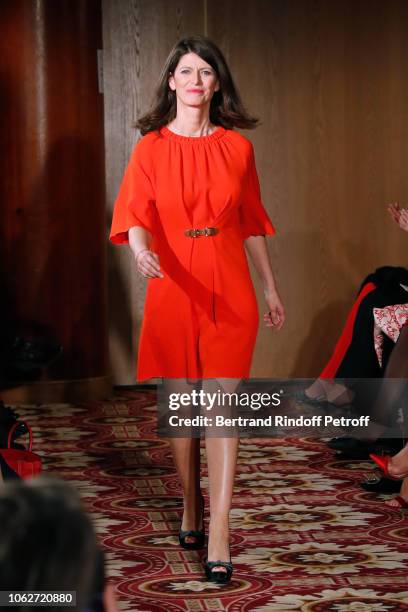 Journalist at LCI Magali Lunel, dressed by Tibi, walks the runway during the "Sauvez le Coeur des Femmes - Red Defile" Show at Hotel Marriot on...