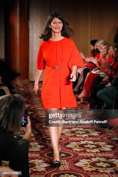 Journalist at LCI Magali Lunel, dressed by Tibi, walks the runway during the "Sauvez le Coeur des Femmes - Red Defile" Show at Hotel Marriot on...