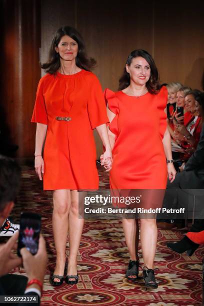 Journalist Magali Lunel, dressed by Tibi, and Journalist at BFMTV Sandra Gandoin, dressed by Maison Lemoine, walk the runway at the end of the...